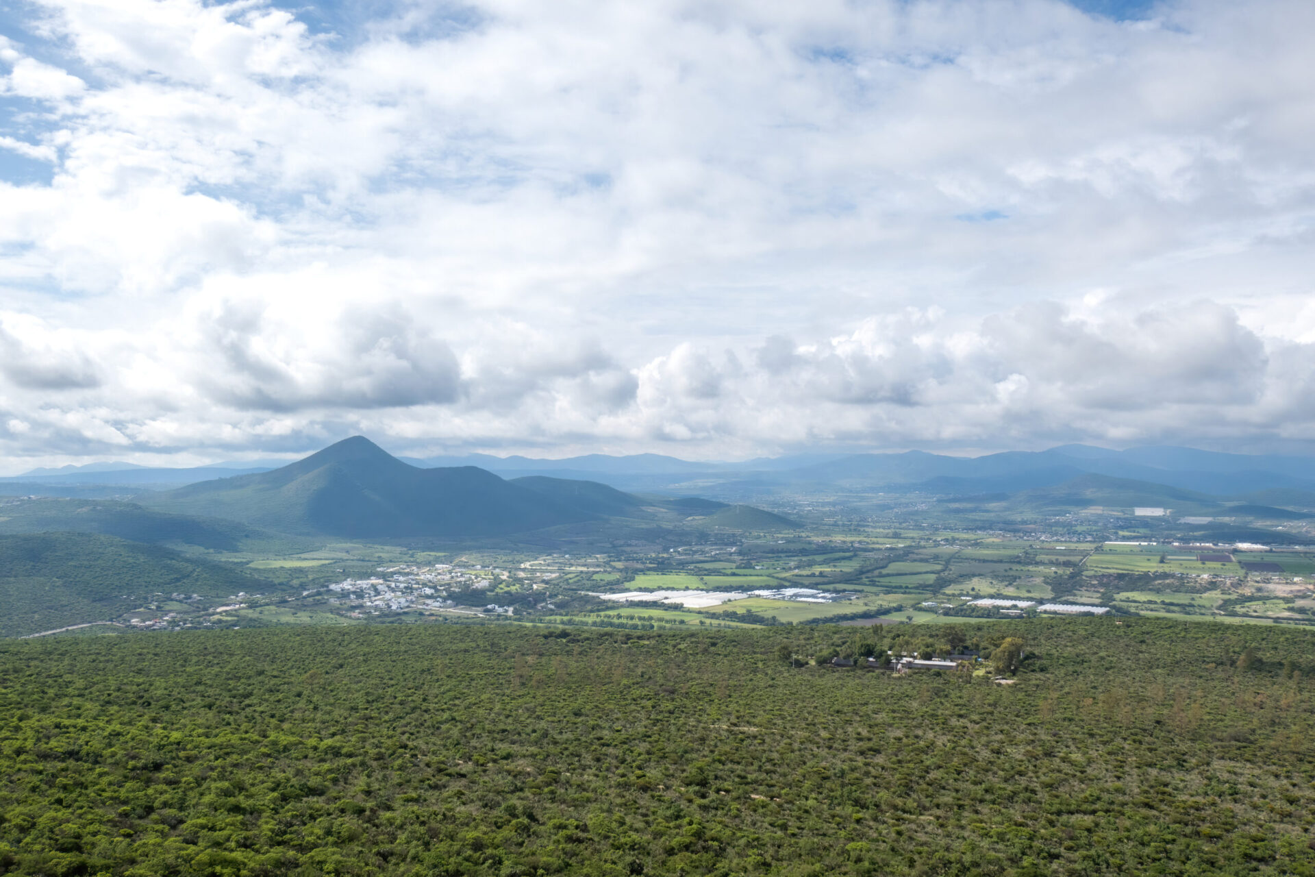 Experience the breathtaking panorama of Queretaro, Mexico, from a birdseye perspective. Witness the harmony of clouds, sky, plants, water, and urban design. Immerse yourself in the captivating landscapes, cityscapes, and mountainous horizons that define this metropolis